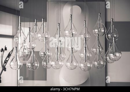 Interior lighting design: Apartment with pending light bulbs and canvas wall lamp. Miami, Florida, USA. Stock Photo