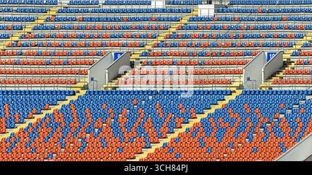 Multi Colored Arena seats of yellow tribune on sport stadium with empty outdoor arena Stock ...