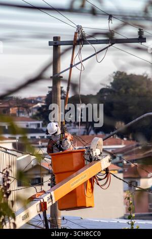 Sao Paulo, Brazil, July 13, 2025. An employee of Enel, an energy company in Saão Paulo, SP, performs maintenance on the high-voltage power grid that p Stock Photo