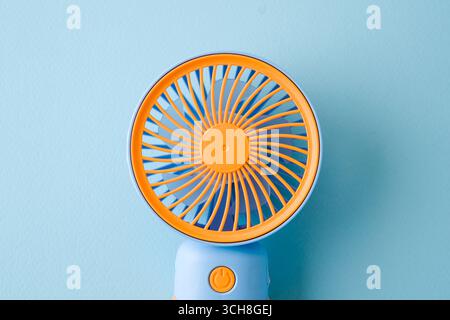 Portable mini hand fan isolated on white background Stock Photo