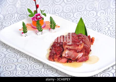 Hong Kong Honey-Glazed Char Siu on White Plate Stock Photo