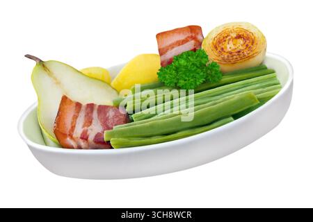 German hotpot stew with pears bacon an green snap beans isolated on white background   Birnen, Bohnen und Speck Stock Photo
