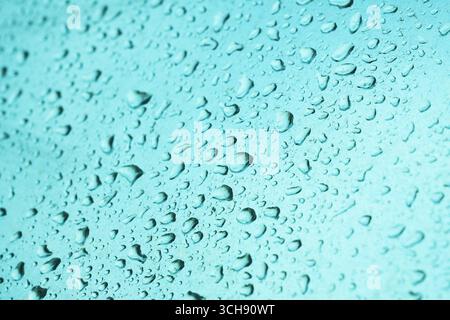 Raindrops on smooth metallic industrial object surface, weather and climate concept, selective focus Stock Photo