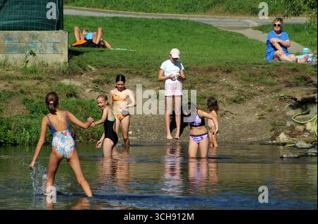 People enjoying the last day of summer holidays and beautiful weather on the Berounka river in Cernosice - Mokropsy, Czech Republic, August 31, 2025. Stock Photo