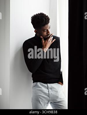 Thoughtful sad black man looking somewhere Stock Photo