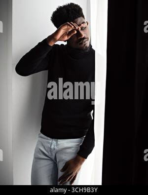 Thoughtful sad black man looking somewhere Stock Photo
