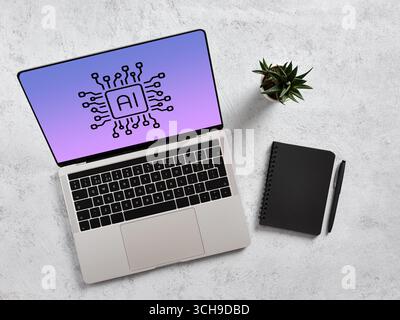 Modern laptop displaying an artificial intelligence chipset on screen, resting on a desk beside a notebook and pen, illustrating AI integration in wor Stock Photo