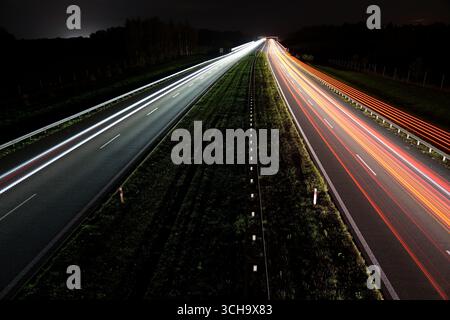 Late evening traffic on a motorway. Speed, colour, perspective Stock Photo