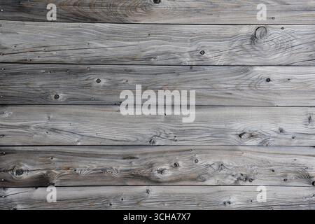 Weathered wood board wall. Horizontal lines. Greyish wood siding board. Stock Photo