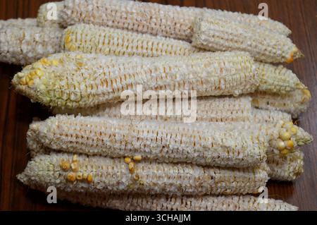 the corn cobs after the kernels have been removed, the edible seeds of the maize plant, typically yellow or white, a source of dietary fiber that aids Stock Photo