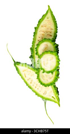 Two halves with three slices of bitter gourd in stack are isolated on white background with clipping path. Stock Photo