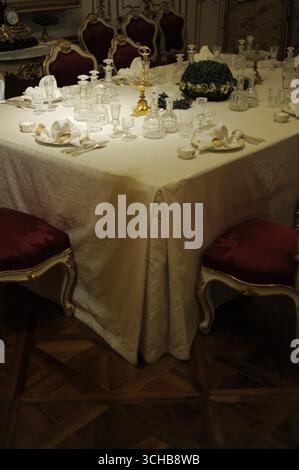 Experience the grandeur of imperial Vienna with this evocative image of a lavishly set table at Schönbrunn Palace, capturing the opulence and timeless Stock Photo
