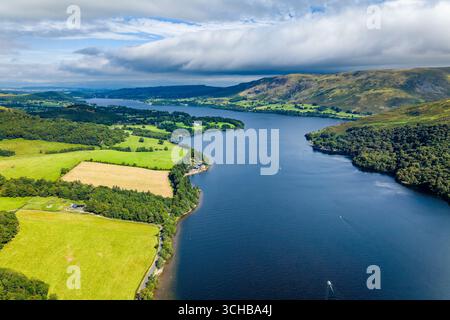 Dramatic clouds floating above the serene waters of Ullswater in the Lake District Stock Photo