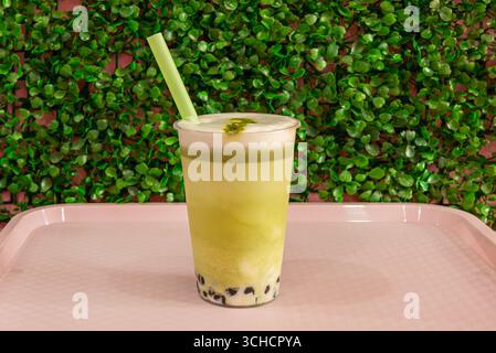 Reinvented classic: An iced latte with strong espresso, cold milk, and clear ice cubes, captured in a crystal glass with cool condensation Stock Photo