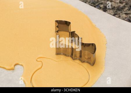 Halloween Bat Cookie Cutter on Cookie Dough Stock Photo