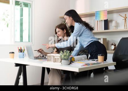 Creative Team Collaborating on Design Project Stock Photo