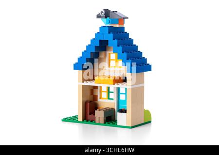 House made of classic building blocks, home of plastic toy colour bricks studio isolated on white background Stock Photo