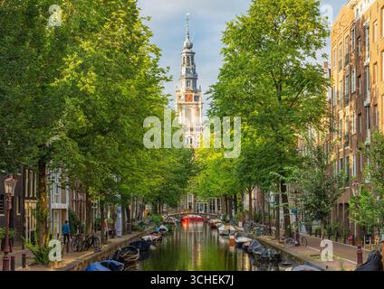 Amsterdam in the summer, famous Zuiderkerk church Tower seen from the canal Stock Photo