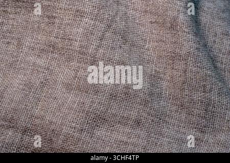Crumpled textile texture as a background. Natural fabric linen texture for design. Close up Stock Photo