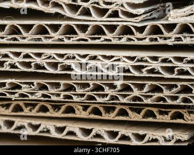 Macro photo of a stack of thick corrugated cardboard sheets. Background. Stock Photo