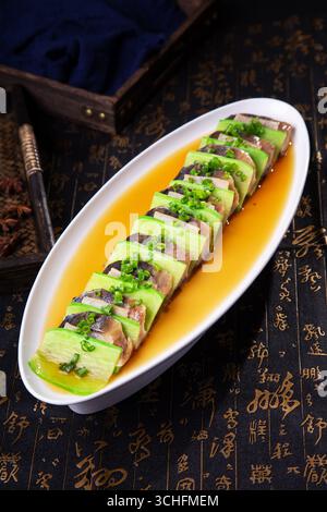 Steamed Spanish Mackerel with Salted Pork and Cucumber on Soy Broth Stock Photo