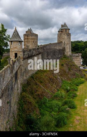 Close up view of the massive medieval curtain walls of Fougères Castle in Brittany, France, showing its defensive architecture and stone construction Stock Photo