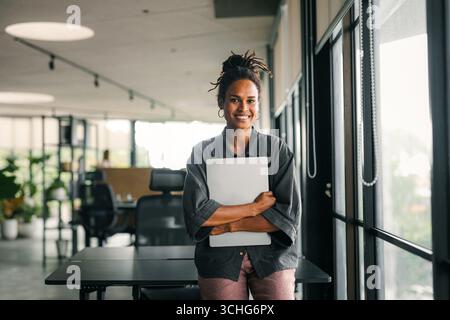 Successful happy african american business woman, startup coworker or software programmer engineer Stock Photo