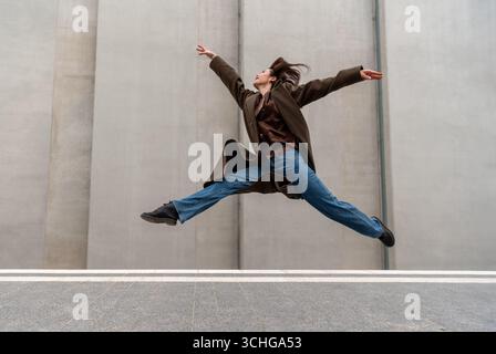 Ballerina jumping and dancing on the streets of Stuttgart city Stock Photo