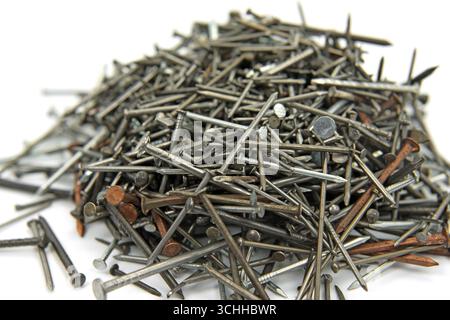 Many different nails against a white background Stock Photo