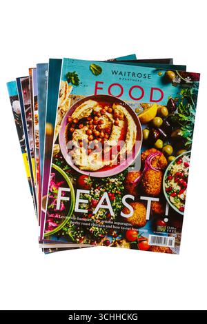 Pile of Waitrose & Partners Food magazine isolated on white background - magazine cover Royal Warrant Stock Photo
