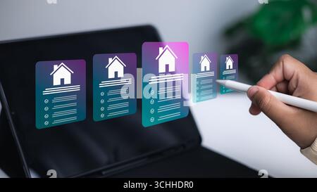 Futuristic digital real estate search with housing icons on tablet screen. Concept of smart property, online home listing, proptech, and modern techno Stock Photo