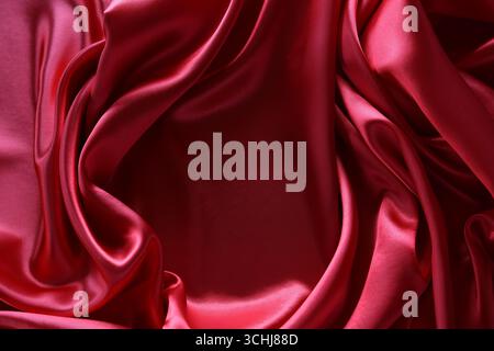 Ripples in red silk fabric Stock Photo