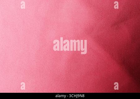 Smooth bright red fabric textile background used as soft surface for modern fashion design and stylish decorative concepts Stock Photo
