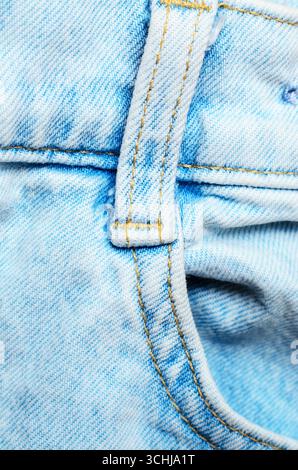 Closeup of belt loop on light blue denim fabric showing detailed stitching and texture for casual fashion and clothing design concepts Stock Photo