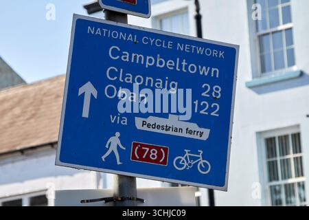 national cycle network distances sign for campbeltown claonaig and oban scotland from ballycastle northern ireland via passenger ferry Stock Photo