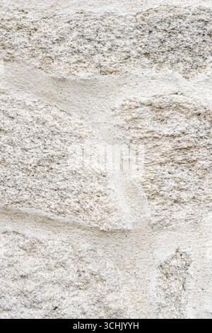 The solid foundation of a building with a granite block wall A Symbol of Strength Stock Photo