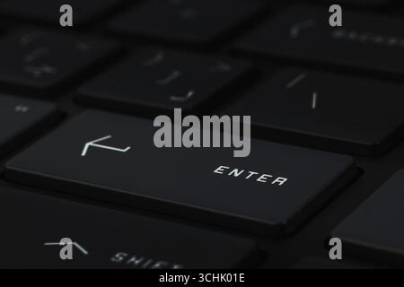 Close-up and full view of a modern computer keyboard, enter key Stock Photo