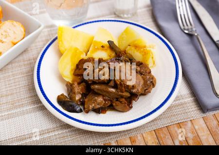 Fried rabbit liver served with boiled potato Stock Photo