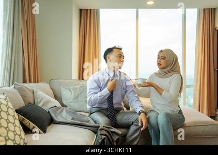 A Casual Conversation Taking Place Between Two Professionals in a Modern Living Room Stock Photo