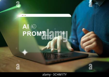 Creating innovative AI prompts via laptop in a dimly lit workspace filled with inspiration Stock Photo