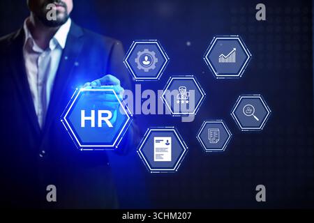 HR professional interacting with digital technology to manage workforce effectively Stock Photo