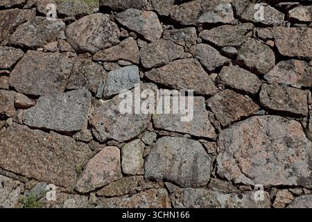 Closeup of old stone wall background texture. Stock Photo