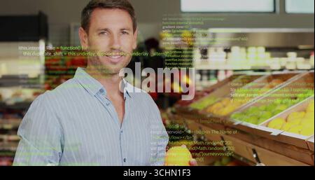 Browsing man picking apples at fruit bins in produce aisle with code overlay, copy space Stock Photo