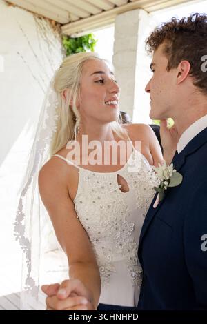 Bride and groom sharing romantic moment while dancing at wedding reception Stock Photo