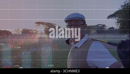 Smiling Chinese golfer holding golf club on fairway at sunrise, in flat cap, copy space Stock Photo