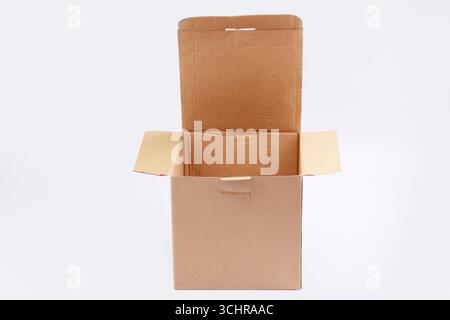 Brown cardboard box with open position isolated on white background. Stock Photo
