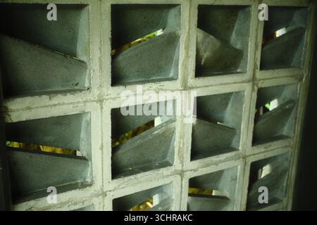 A close-up of a concrete breeze block wall for natural ventilation and aesthetic purposes Stock Photo