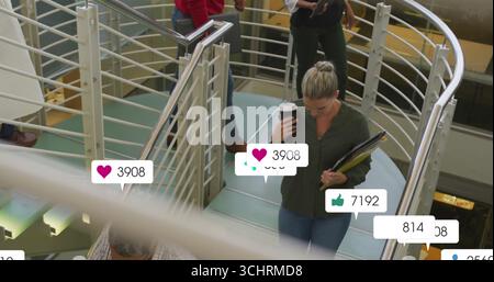 Walking woman holding coffee, folders on mezzanine, with floating social media icons, copy space Stock Photo