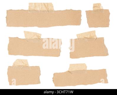Set of a variety of blank cardboard notes with irregular borders affixed with masking tape isolated on white background Stock Photo