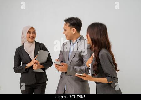 Professional Team Engaging in Collaborative Discussion in Modern Office Stock Photo
